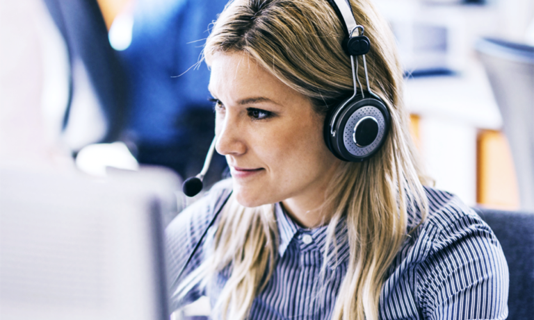 Virtual receptionist answering a phone call at her desk