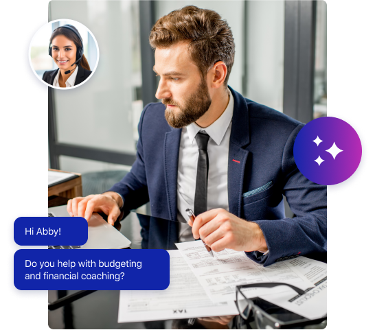 A man in a suit sits at a desk reviewing financial documents. A chat bubble asks, Hi Abby! Do you help with budgeting and financial coaching? highlighting Abby’s expertise in financial call answering, with her profile image above the bubble.