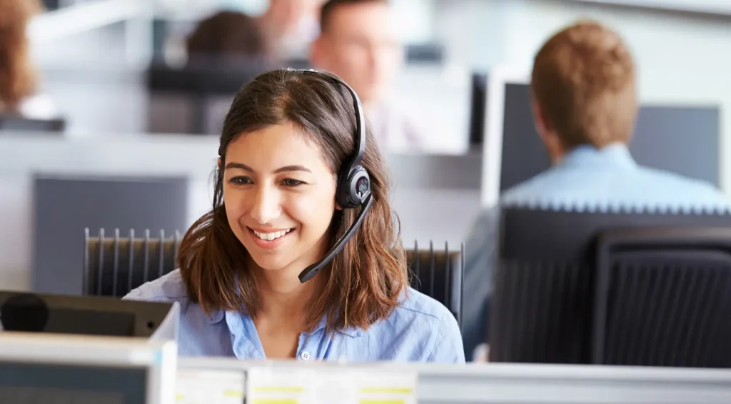 Abby Connect receptionist answering a call with a headset