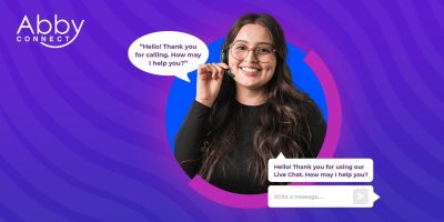 A smiling woman wearing glasses gestures while two text bubbles read, “Hello! Thank you for calling. How may I help you?” and “Hello! Thank you for using our Live Chat. How may I help you?” The Abby Connect logo is in the top left.