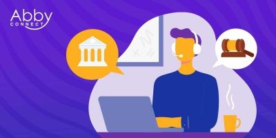 Illustration of a person with a headset sitting at a laptop. Speech bubbles show a courthouse and a gavel. There’s a coffee mug, wall art, and the “Abby Connect” logo in the top left on a purple background.