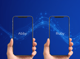 Abby vs Ruby – Virtual Receptionist Comparison Two smartphones side by side, each held in a hand, with “Abby” on the left screen and “Ruby” on the right, set against a dark blue background with glowing data waves.