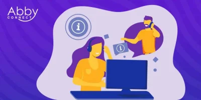 Illustration of a woman wearing a headset and working on a computer, with a man also wearing a headset appearing in a chat bubble. Information icons are shown. The Abby Connect logo is in the top left corner.