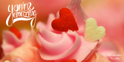 Close-up of pink frosting swirls topped with red and white heart-shaped sprinkles. Handwritten text reads youre amazing in the top left and with appreciation, Team Alay in the bottom right—Show Love in every detail.