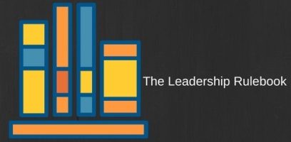 Illustration of five colorful books standing upright on a shelf, with the text The Leadership Rulebook on a dark background to the right of the books.