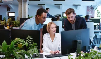 Team collaborating in modern office workspace illustrating domain expertise and AI technology working together to solve business challenges