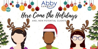 Illustration of three faceless people in festive attire, two with reindeer antlers and one with a Santa hat, under colorful ornaments. Text reads “Abby Connect. Here Come the Holidays and New Potential Clients.”.